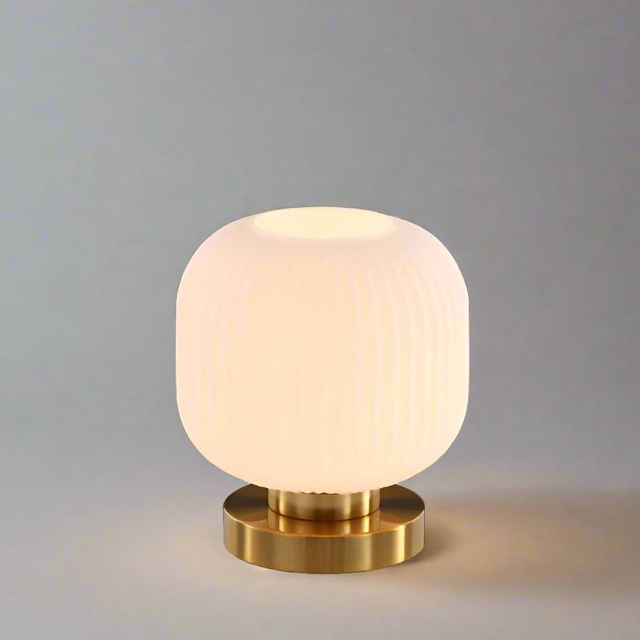 Amber Glass Table Lamp with Minimalist Metal Frame and Warm Ambient Light