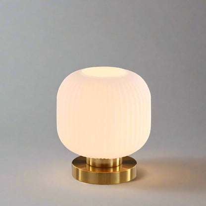 Amber Glass Table Lamp with Minimalist Metal Frame and Warm Ambient Light