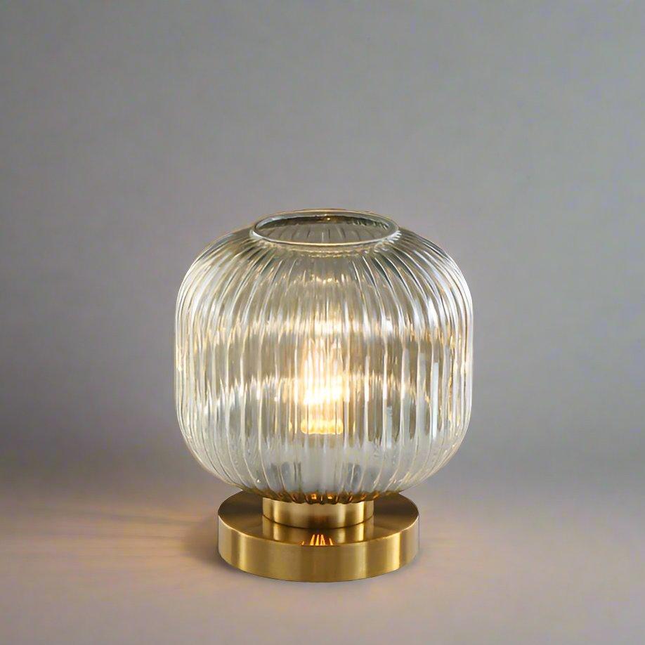 Amber Glass Table Lamp with Minimalist Metal Frame and Warm Ambient Light