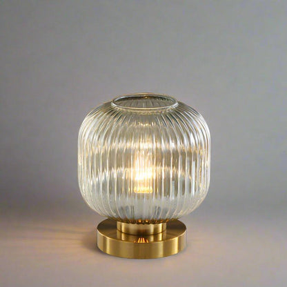 Amber Glass Table Lamp with Minimalist Metal Frame and Warm Ambient Light
