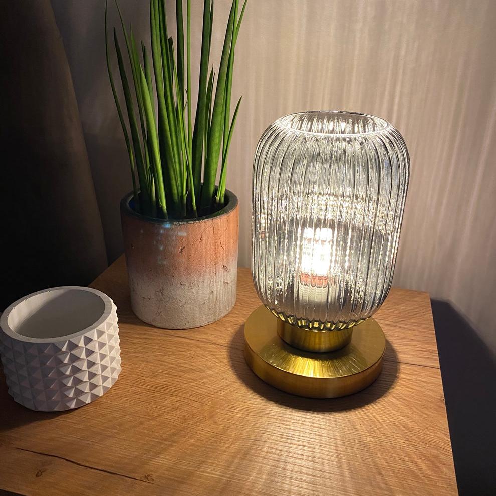 Amber Glass Table Lamp with Minimalist Metal Frame and Warm Ambient Light