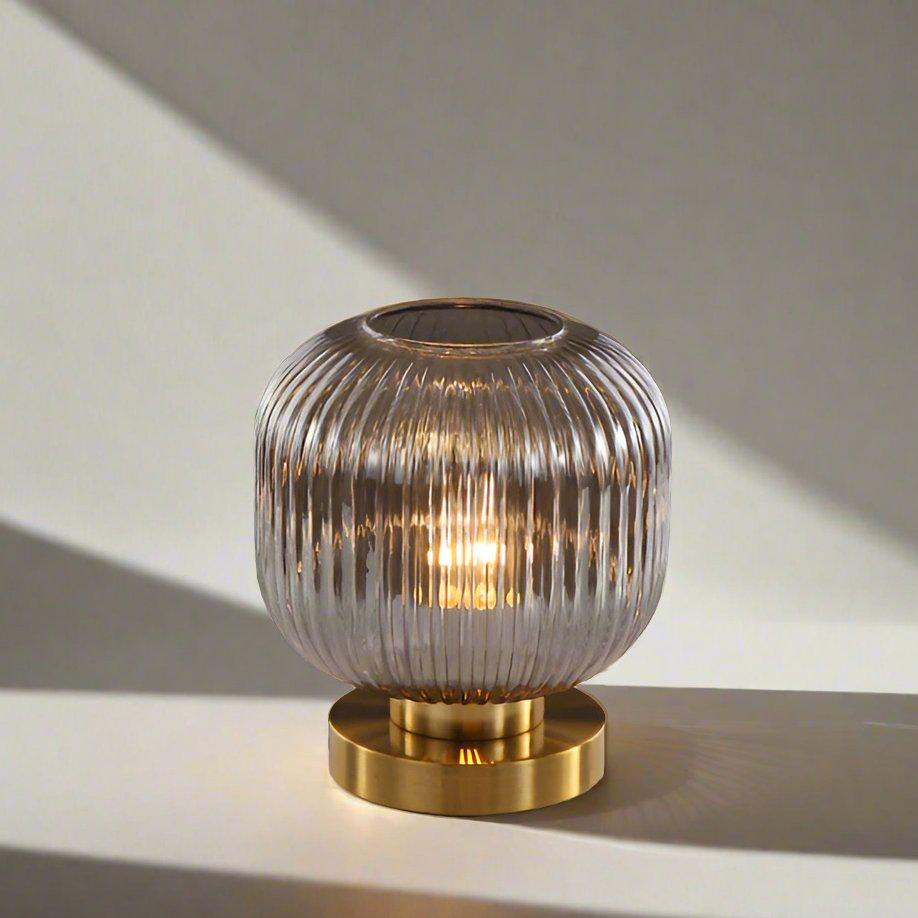 Amber Glass Table Lamp with Minimalist Metal Frame and Warm Ambient Light