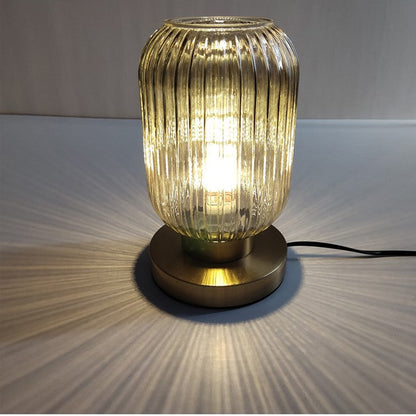 Amber Glass Table Lamp with Minimalist Metal Frame and Warm Ambient Light
