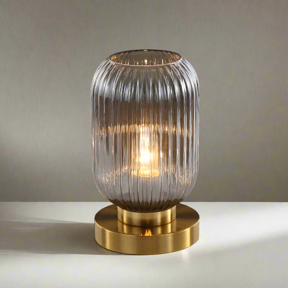 Amber Glass Table Lamp with Minimalist Metal Frame and Warm Ambient Light