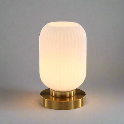 Amber Glass Table Lamp with Minimalist Metal Frame and Warm Ambient Light