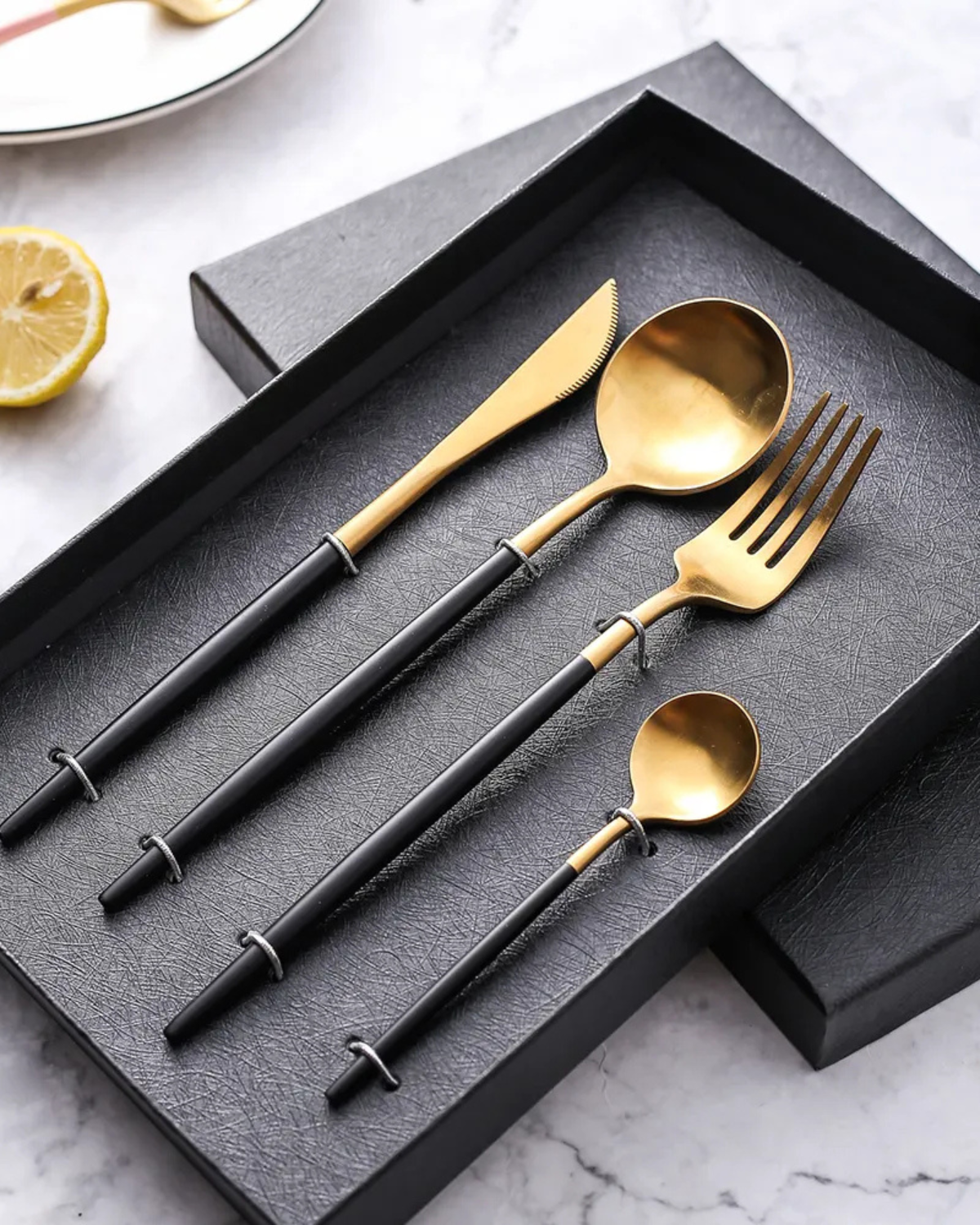 Stainless Steel Cutlery Set with Gold Accents and Matte Black Handles