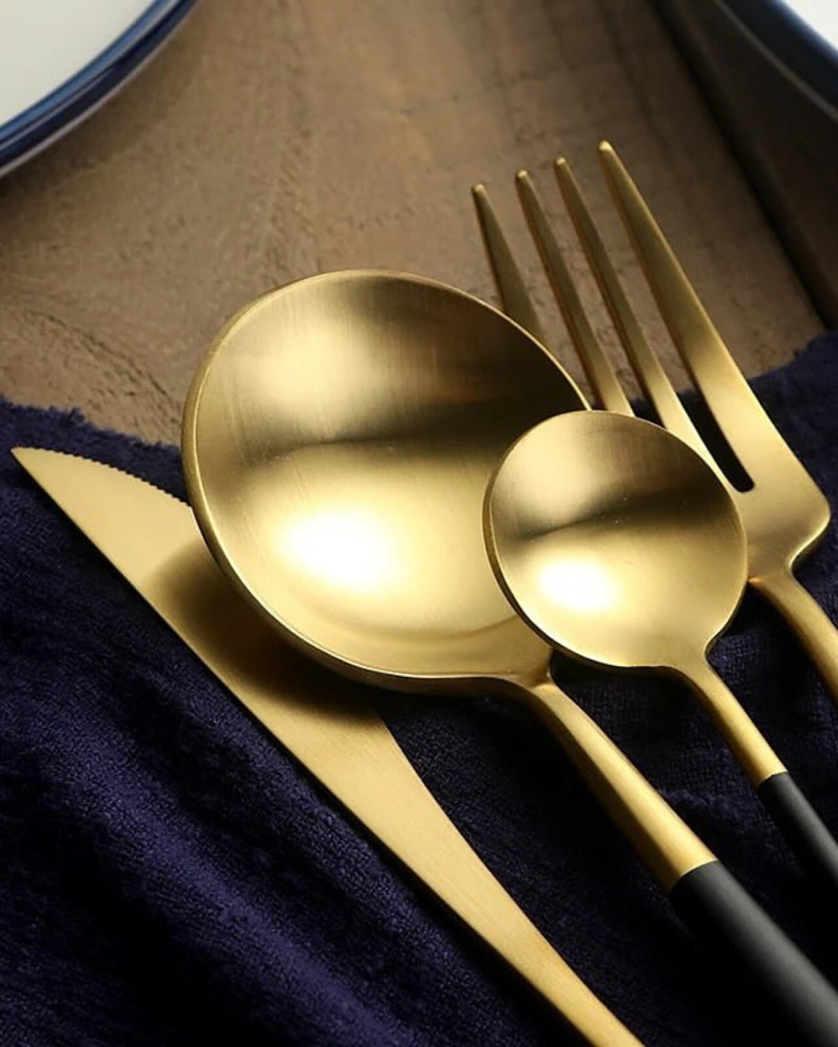 Stainless Steel Cutlery Set with Gold Accents and Matte Black Handles
