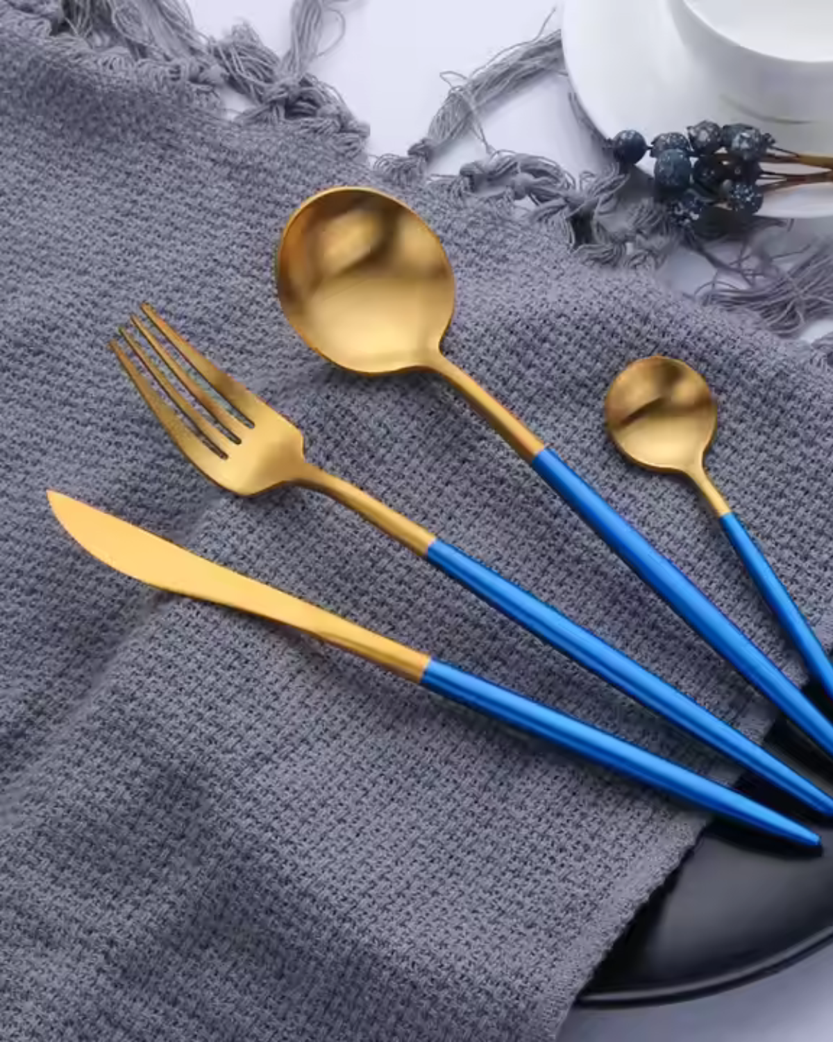 Stainless Steel Cutlery Set with Gold Accents and Matte Black Handles
