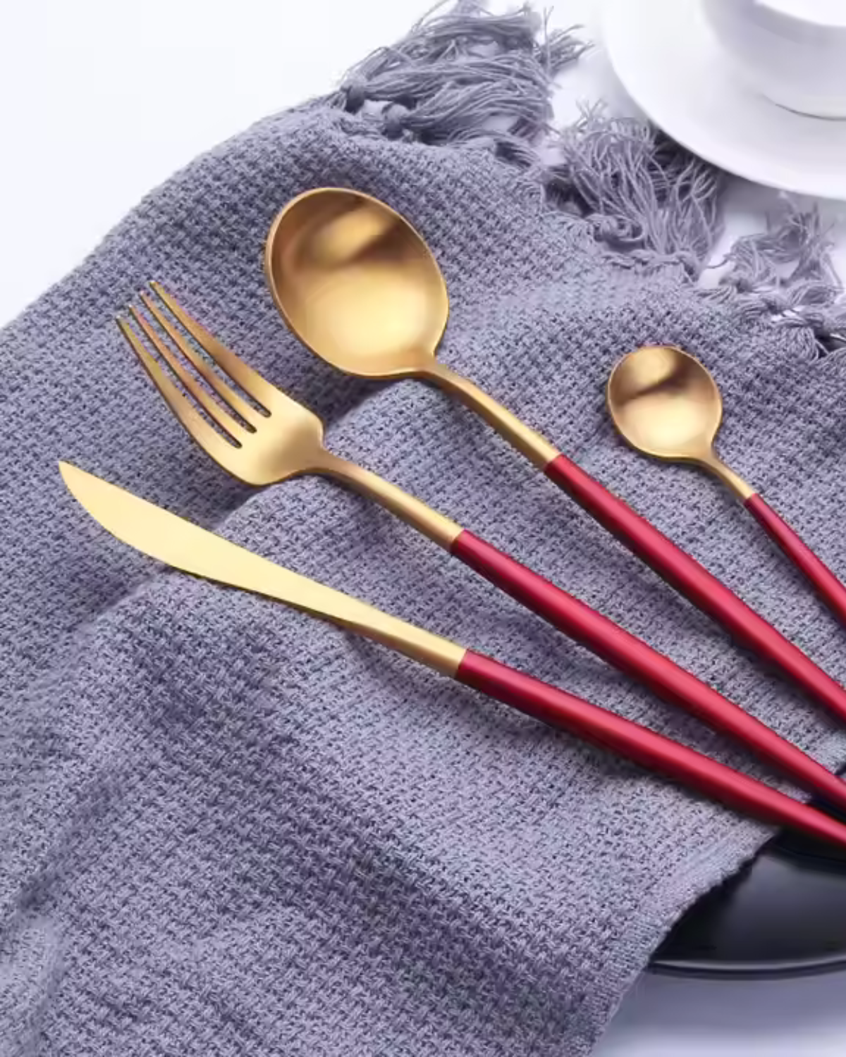 Stainless Steel Cutlery Set with Gold Accents and Matte Black Handles