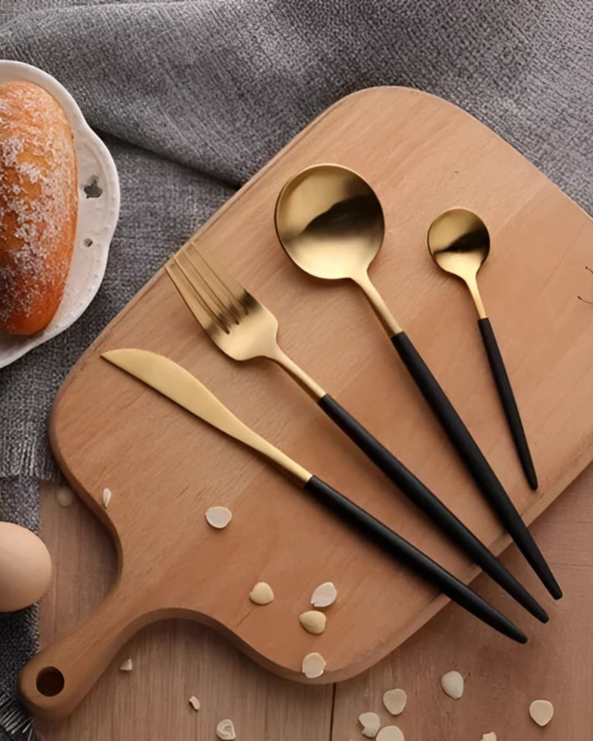 Stainless Steel Cutlery Set with Gold Accents and Matte Black Handles