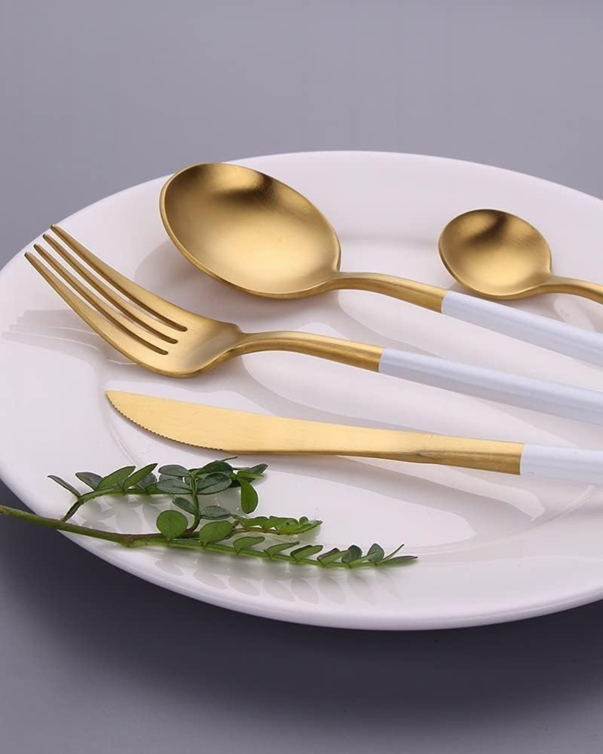 Stainless Steel Cutlery Set with Gold Accents and Matte Black Handles